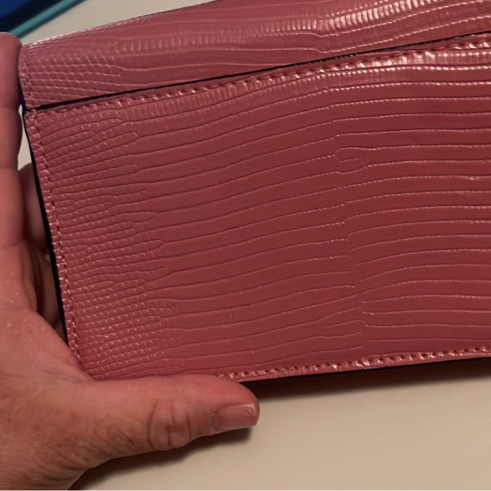 Pink cross body with flower in front